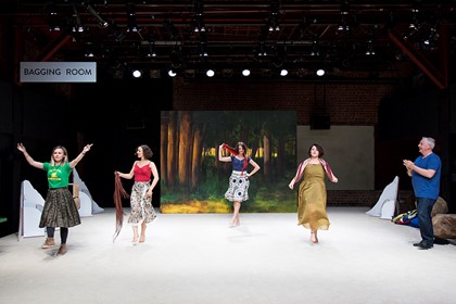 Production still for "Come Away with Me to the End of the World". Beth Buchanan (far left) and Patrick Moffatt (far right) with Rosa Voto and dancers. Photographer: Pia Johnson