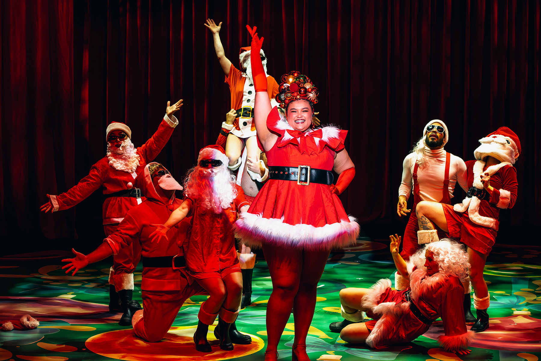 Production photography from F**k Christmas (2024). Photographer: Gregory Lorenzutti. In photograph: Cast of F**k Christmas