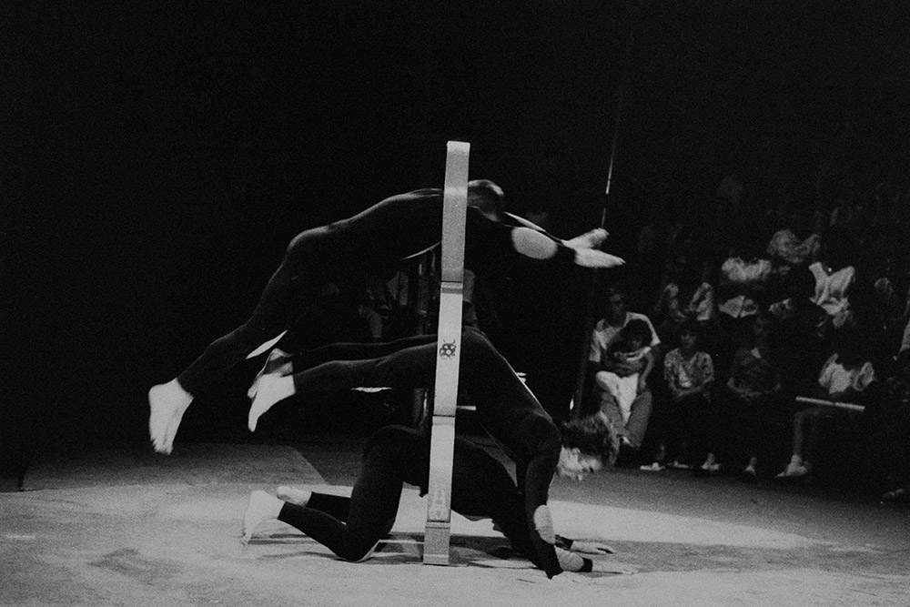 Production still for "Madame Mao". Hoop dives. Photographer: Ponch Hawkes