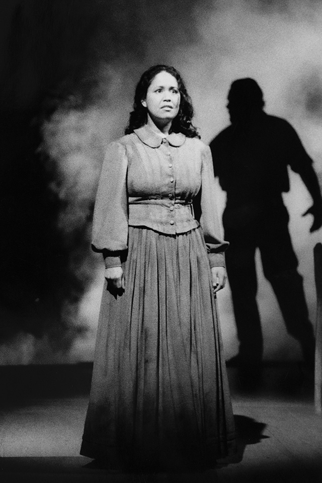 Production still for "Holy Day". L-R: Melodie Reynolds as Obedience, Dino Marnika as Goundry. Photographer: David Wilson