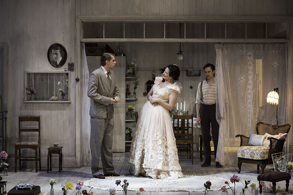 Production still for "The Glass Menagerie". L-R: Harry Greenwood as Jim O'Connor, Pamela Rabe as Amanda Wingfield, Luke Mullins as Tom Wingfield. Photographer: Pia Johnson