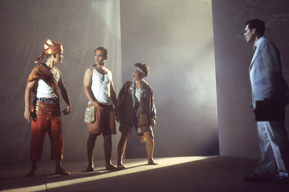 Production still for "Miss Tanaka". L-R: Tony Yap as Hanif, Bradley Byquar as Kazuhiko, Yumi Umiumare as Sakamoto, Jeremy Stanford as Mott. Photographer: Jeff Busby