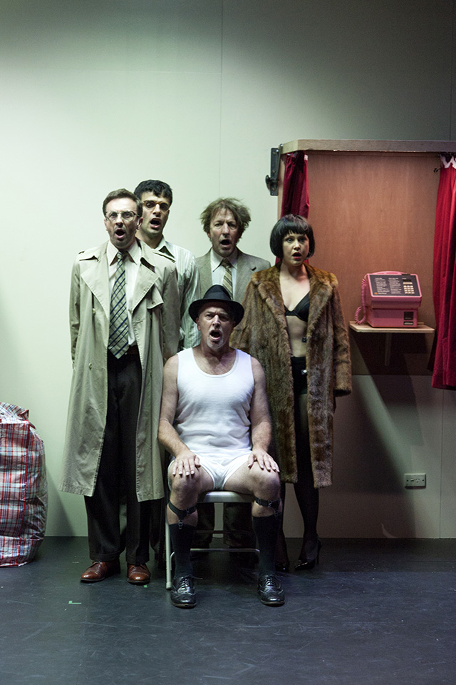 Production still for "The Government Inspector". L-R: Mitchell Butel, Fayssal Bazzi, Greg Stone (seated), Robert Menzies, Eryn-Jean Norvill. Photographer: Pia Johnson