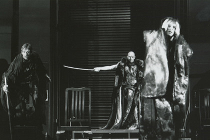Production still for "The Chronicle of Macbeth". L-R: Oliver Sidore as Witch 2, John Nobbs as Banquo's Ghost, Peter Curtin as Macbeth. Photographer: Reimund Zunde