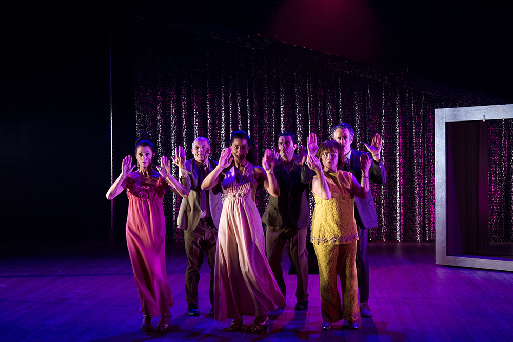 Production still for "Away". L-R: Heather Mitchell, Glenn Hazeldine, Naomi Rukavina, Wadih Dona, Julia Davis, Marco Chiappi. Photographer: Pia Johnson