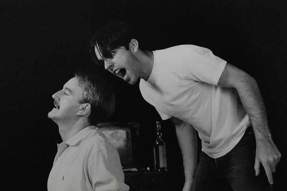 Production still for tour of "Sanctuary". L-R: William Gluth as Robert 'Bob' King, Felix Williamson as John Alderston. Photographer: Jeff Busby