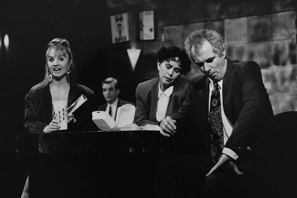 Production still for "The Adman". L-R: Kate Whitbread as Christobelle Adams, Ben Grant as Rhys Burns, Celia de Burgh as Tess McMahon, Shane Bourne as Col Anderson. Photographer: Jeff Busby