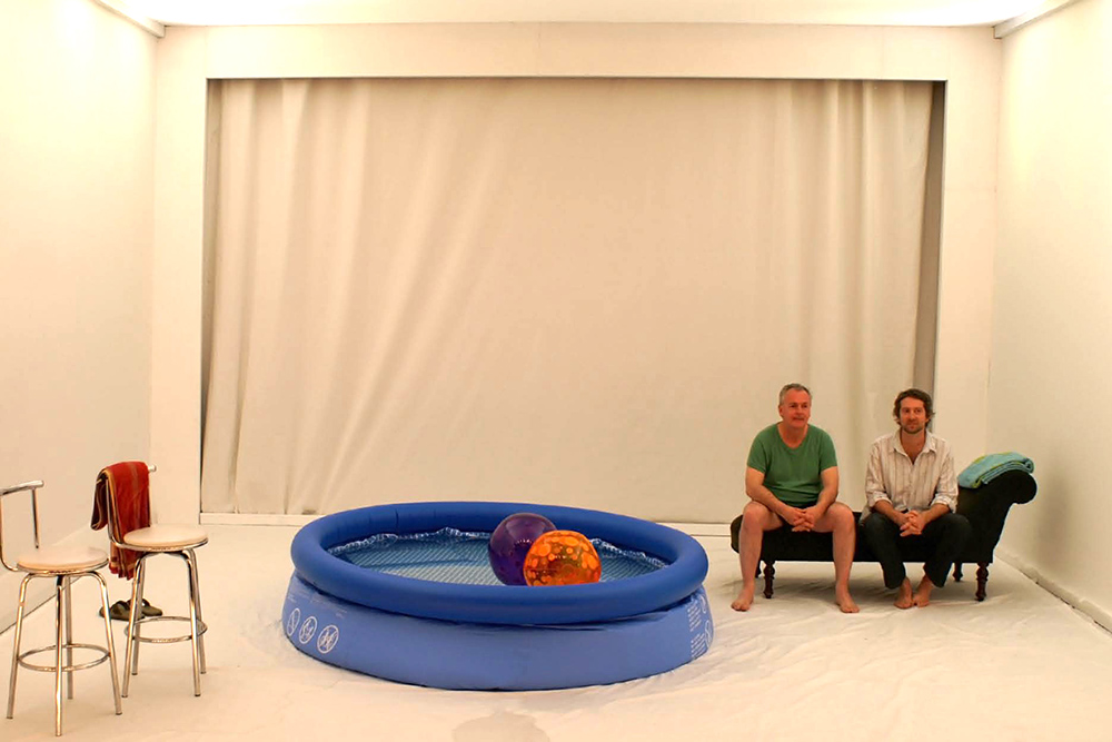 Production still for "Holiday". L-R: Patrick Moffatt, Paul Lum. Photographer: Anna Tregloan