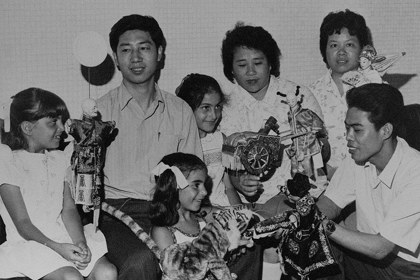 Production still for "the Fukien Puppet Theatre of China". Troupe members show their puppets to Melbourne children. Photographer: Jeff Busby